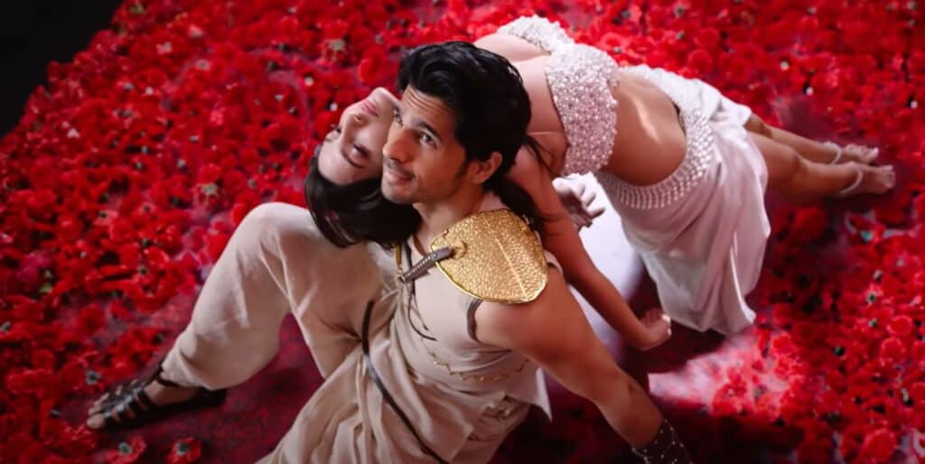 Sidharth Malhotra and Nora Fateh Ali Khan can be seen in the image on the bed of roses for Manike Lyrics song from the movie Thank God