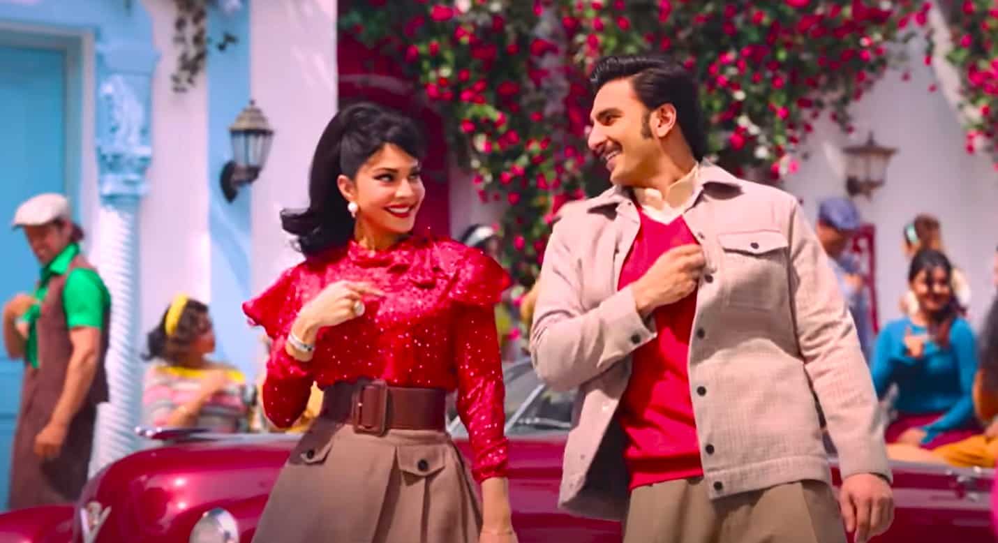 Ranveer Singh and Jaqueline is dancing with the 60's decade background. The actrerss is wearing red dress while actor is wearing a jacket and red tshirt while shooting for Sun Zara Song and Lyrics